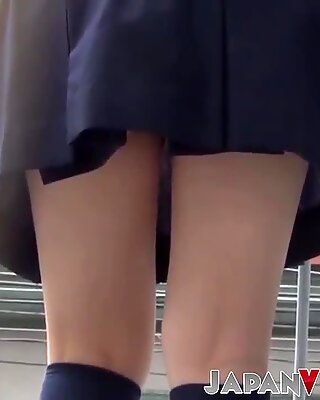 Cute Japanese schoolgirl taped up skirt outdoors