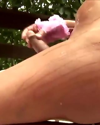 T-girl with massive boobs jerks off big dick in pink gloves
